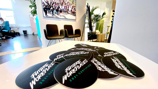 A collection of Future Workplaces 2021 Certified mouse pads on the table