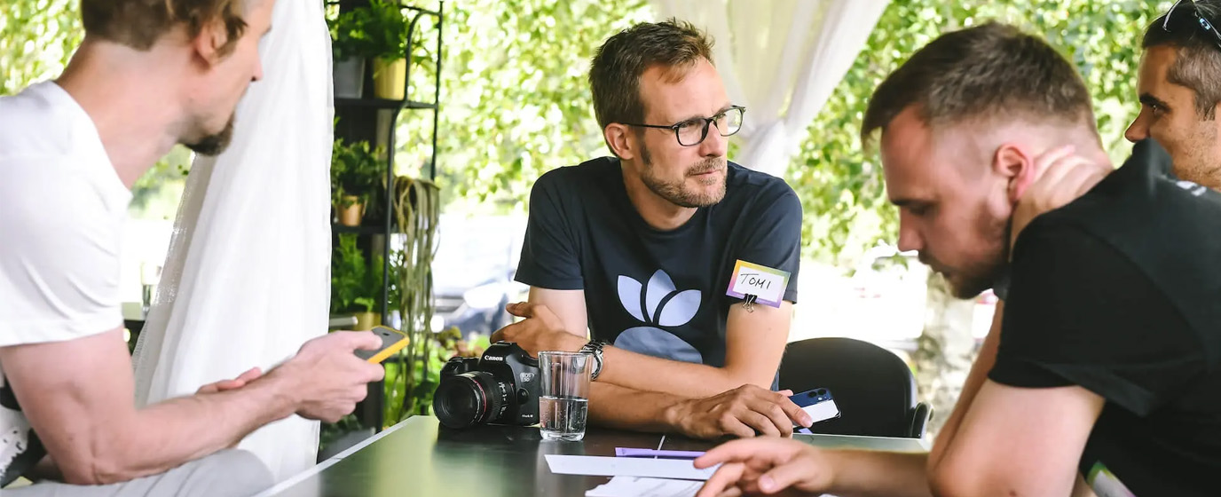 Team members collaborating in a workshop
