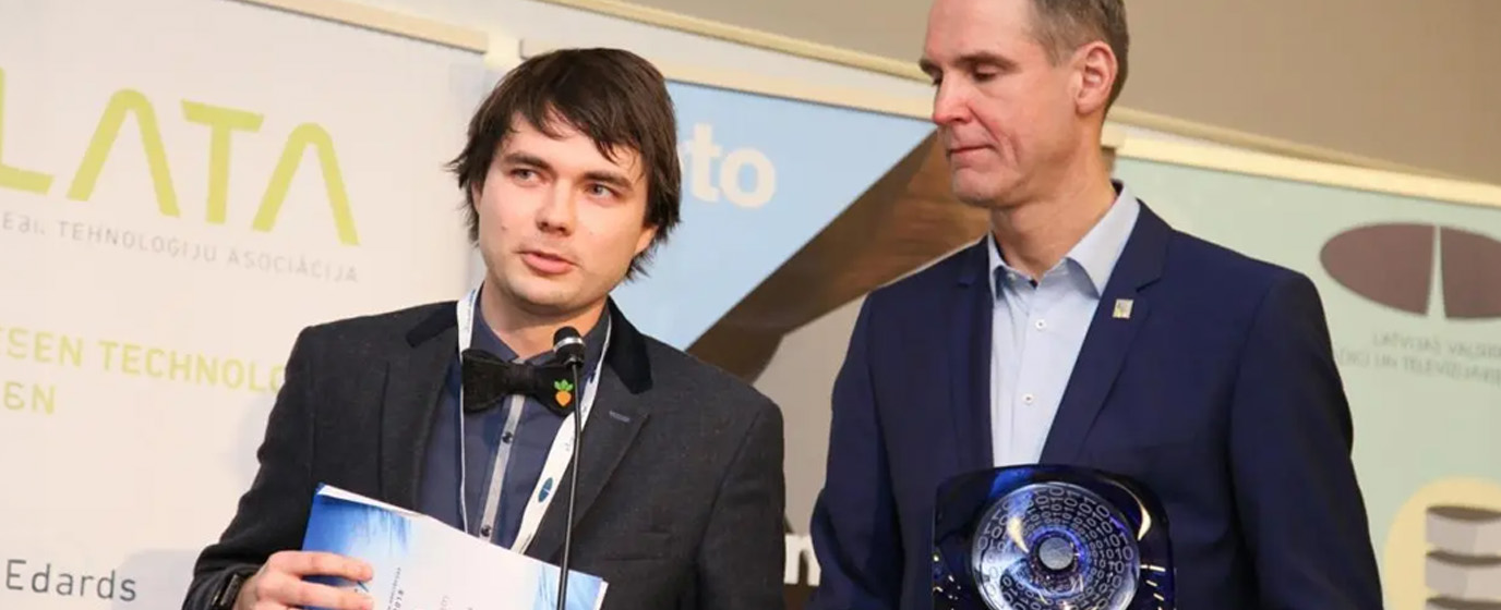 Two men standing with awards in the LATA conference