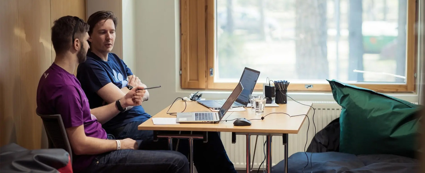 Two developers with laptops