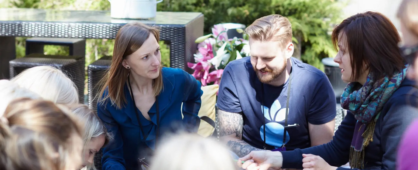 People sitting together outside talking