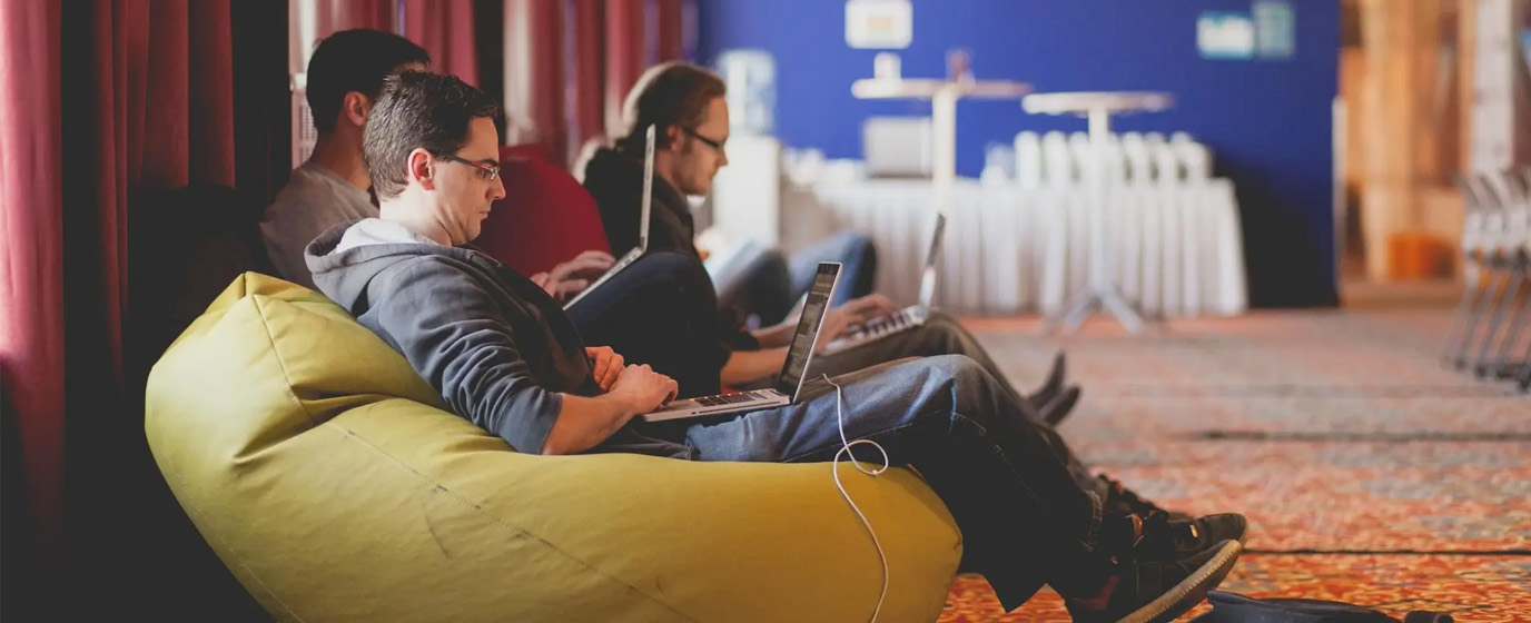 Coders coding in the hallway