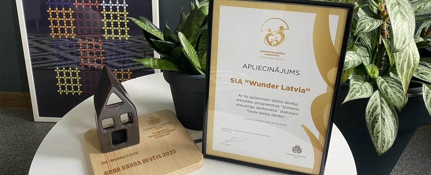 Honorable employer award and a small potted plant on a round table