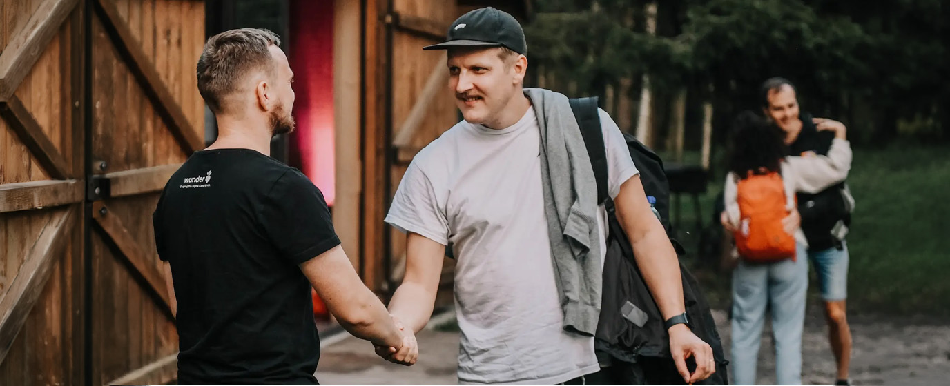 Two persons shaking hands