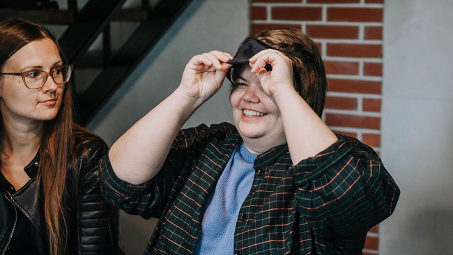 Person taking off the blindfold