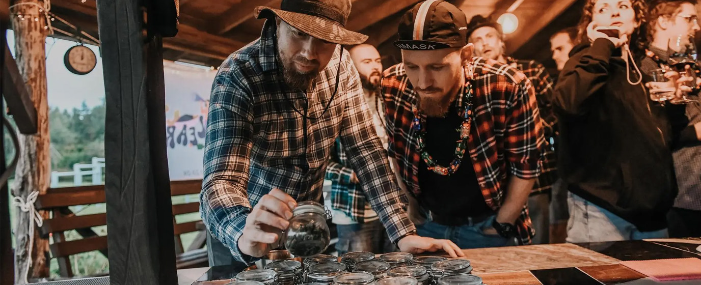 People looking at ingredient together over a tall table